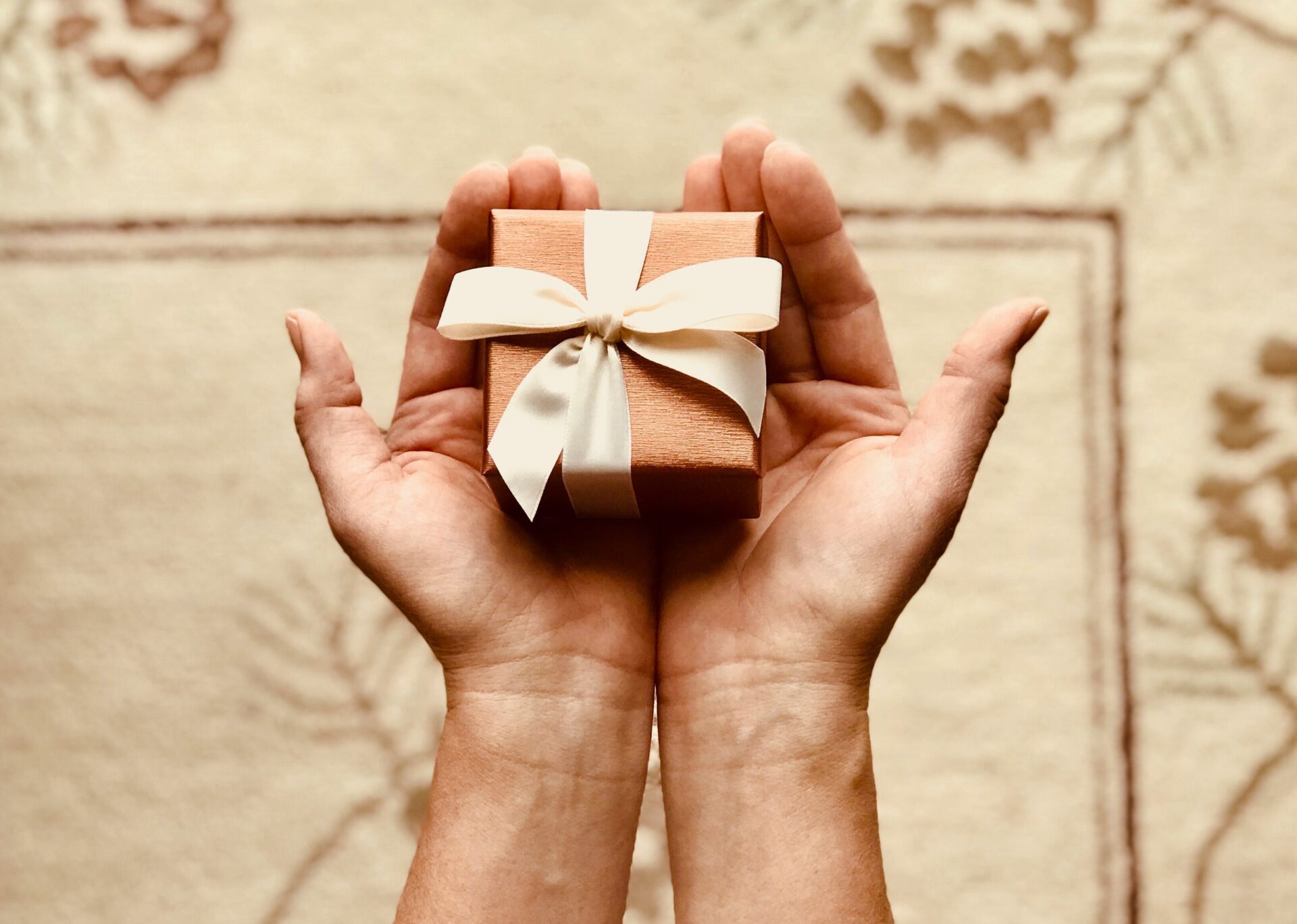 hand holding small gift