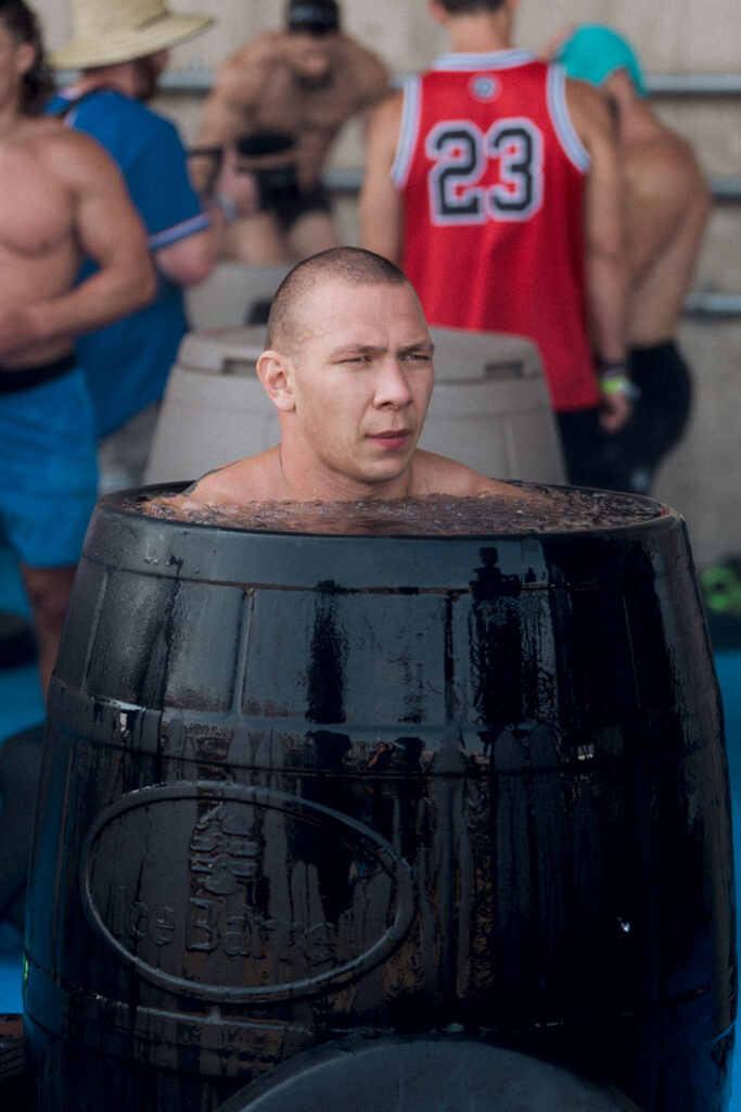 CrossFit Games athlete and 2023 Spirit of the Games award recipient Roman Khrennikov recovers in an Ice Barrel 400